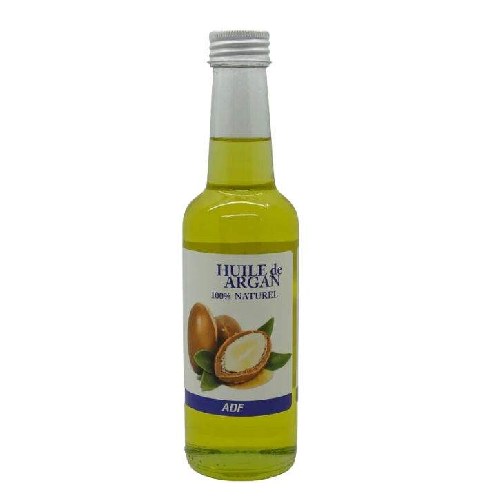 Bottle of ADF Huile de Argan with a white label on a white background