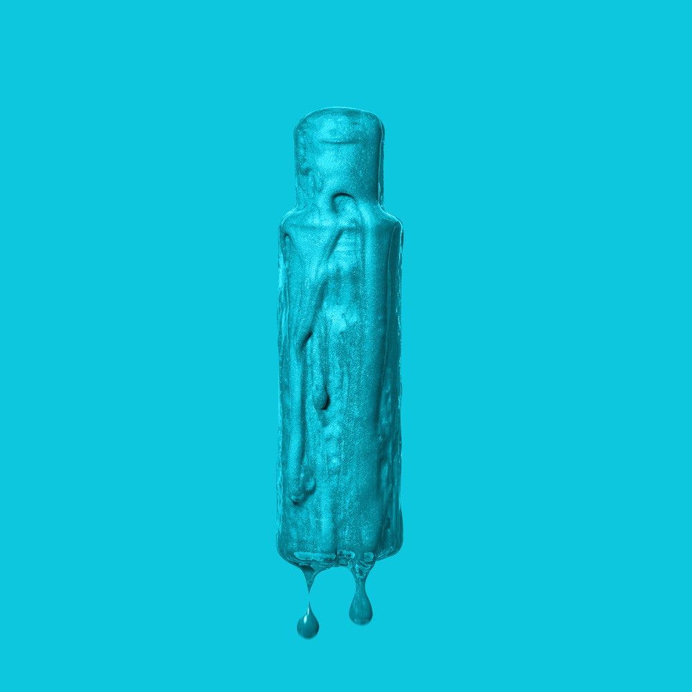 Crazy Color Blue Jade 67 hair dye bottle by Afro Beauty Store on a solid teal background
