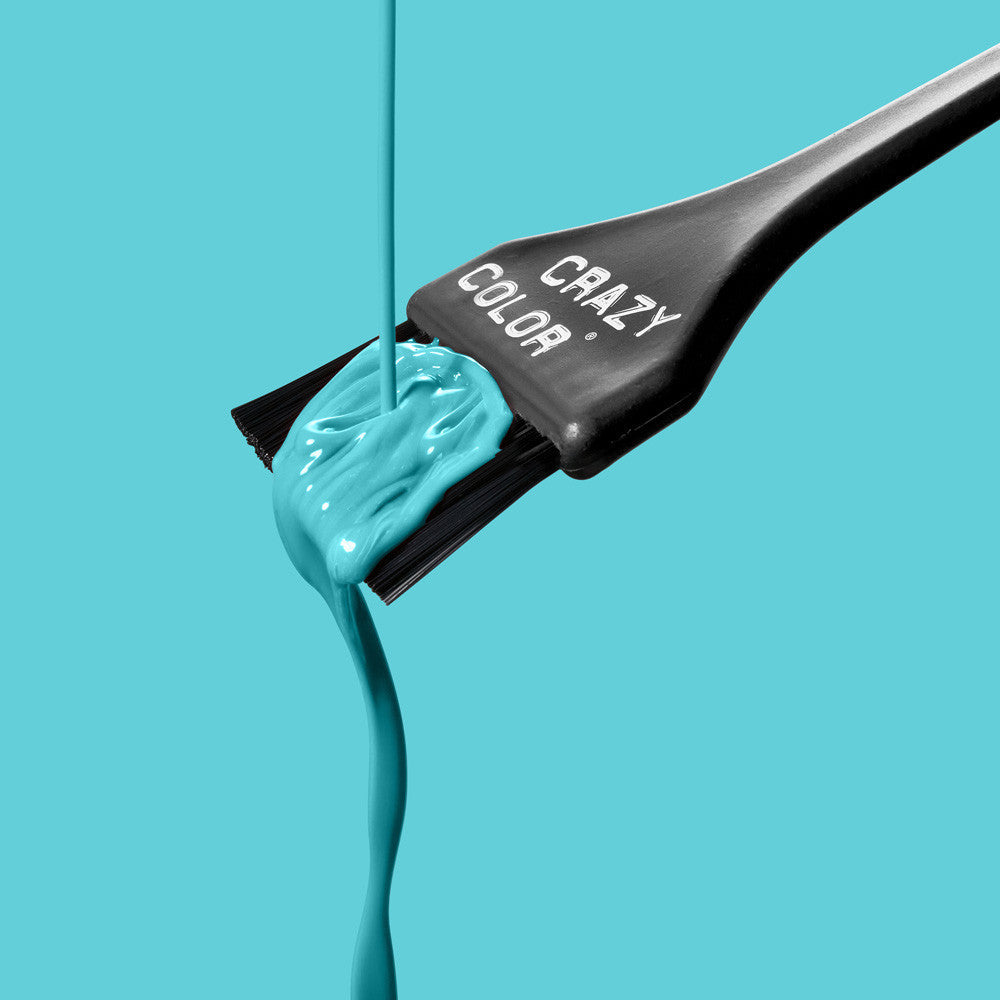 Crazy Color Hair dye brush with Bubblegum Blue colorant on a turquoise background by Afro Beauty Store