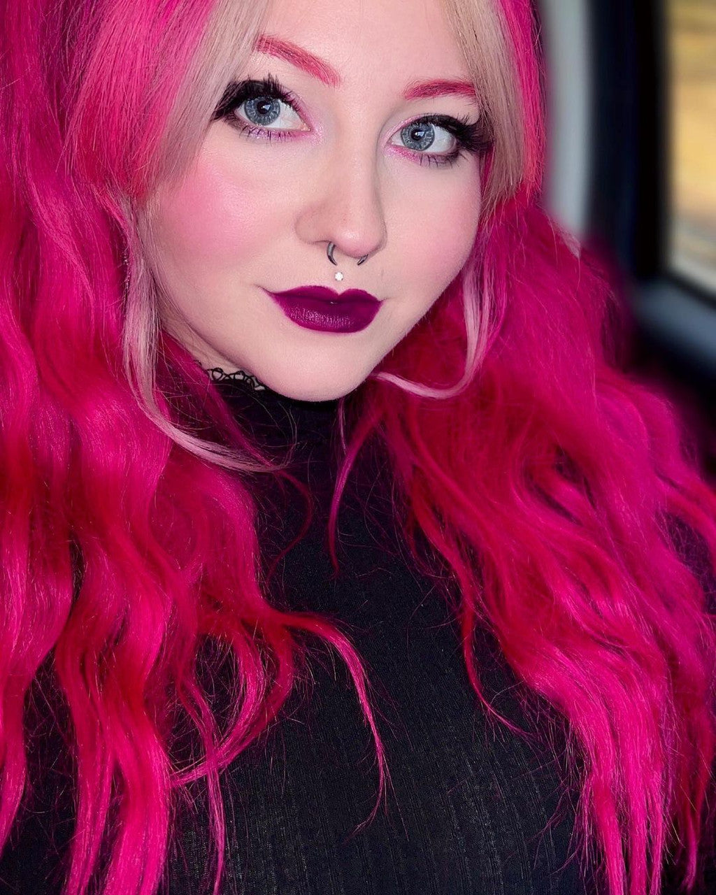 Crazy Color's Person with bright pink hair and dark lipstick looking directly at the camera - Afro Beauty Store