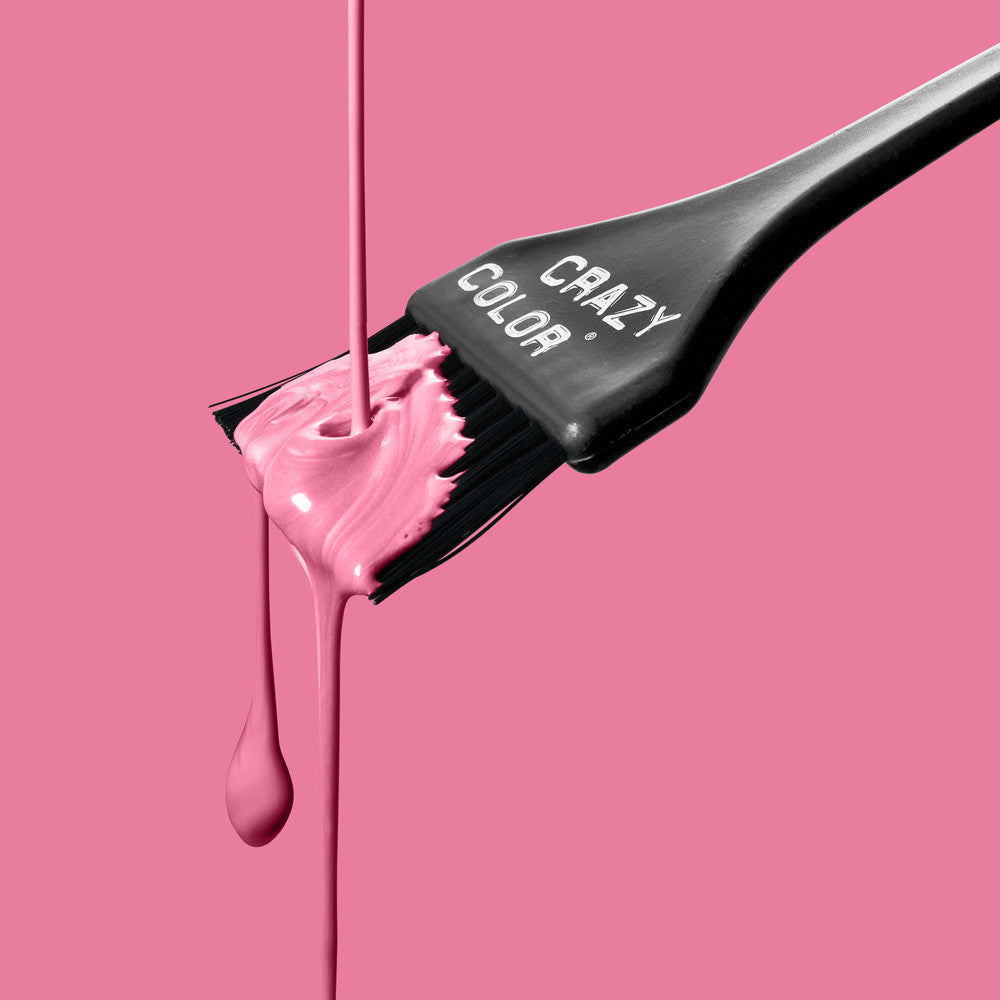 Hair color brush with Crazy Color Candy Floss 65 dye on a pink background, featuring the brand 'Crazy Color' by Afro Beauty Store