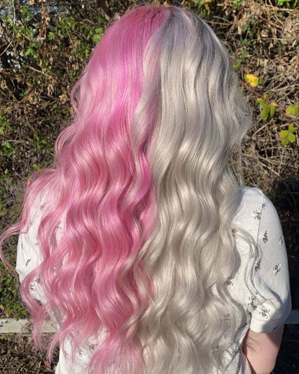 Crazy Color's Person with pink and silver hair standing outdoors by Afro Beauty Store