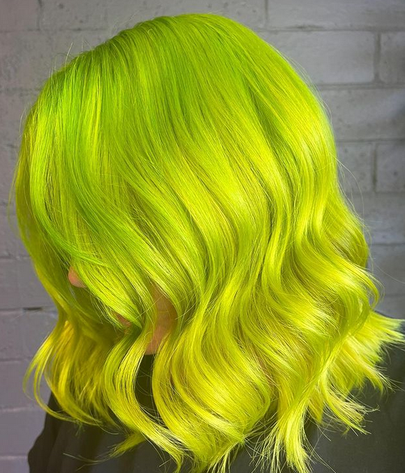 Crazy Color's person with bright green hair by Afro Beauty Store