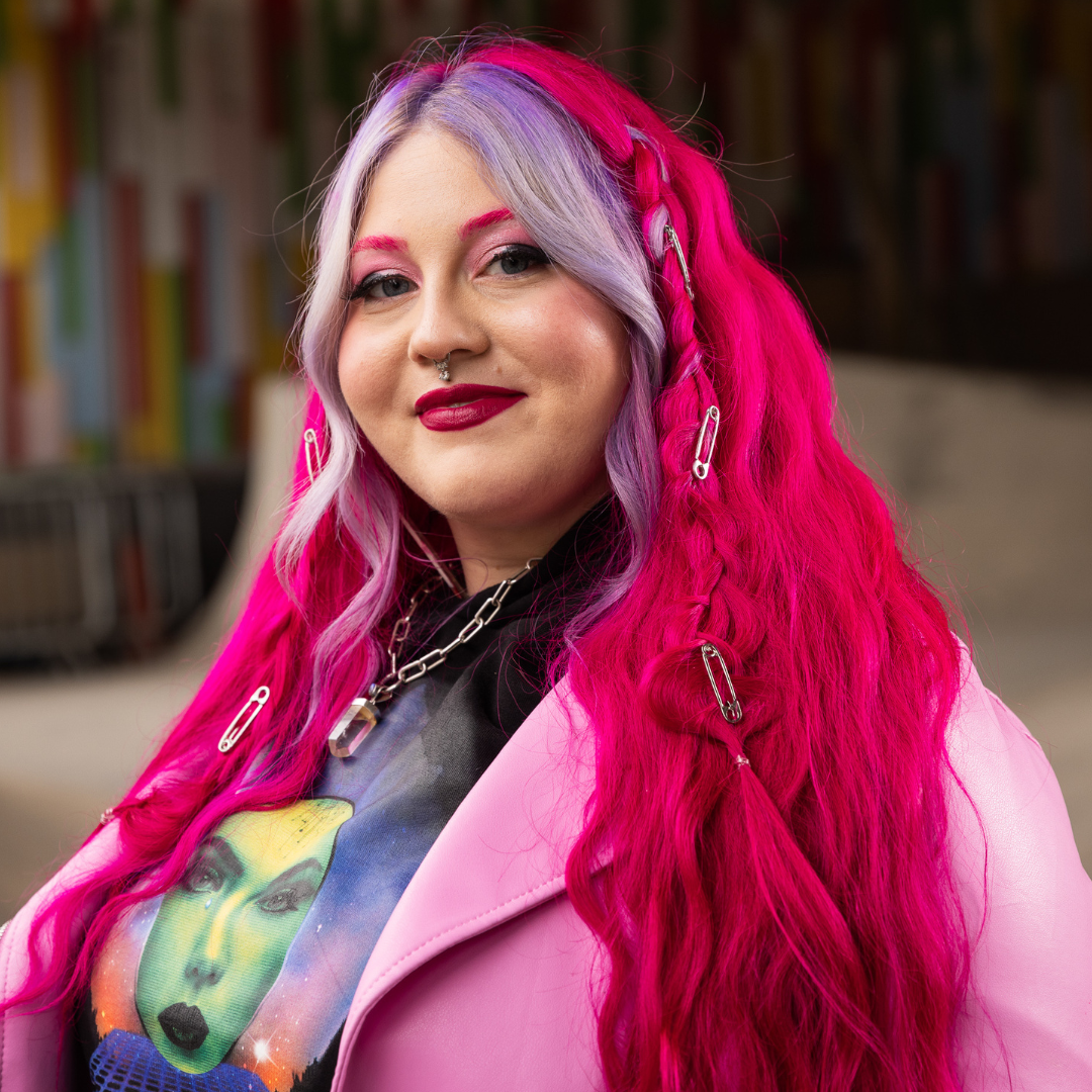 Crazy Color's Person with vibrant pink hair and colorful clothing in a casual setting - Afro Beauty Store