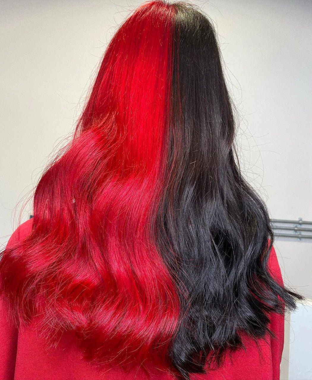 Crazy Color's Person with red and black hair color gradient on a plain background by Afro Beauty Store