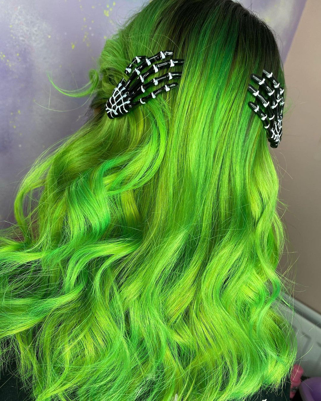 Crazy Color's perons with Green hair with skeleton hair clips on a neutral background by Afro Beauty Store