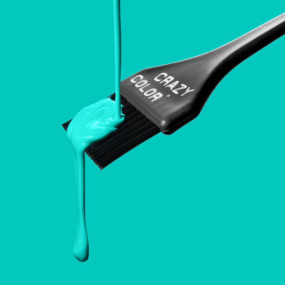 Crazy Color Peppermint 71 hair dye being applied with a 'Crazy Color' brush on a teal background by Afro Beauty Store