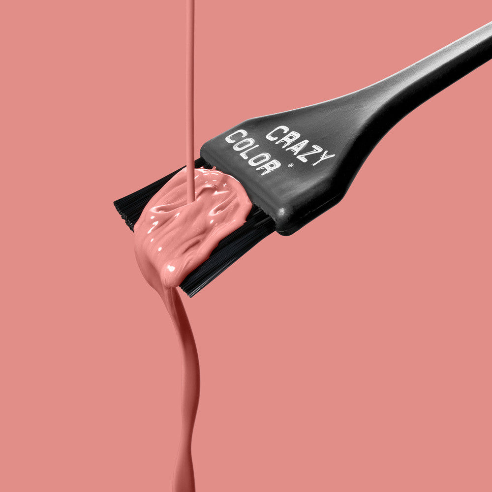 Crazy Color Rose Gold 73 hair color being applied with a 'Crazy Color' brush on a pink background by Afro Beauty Store