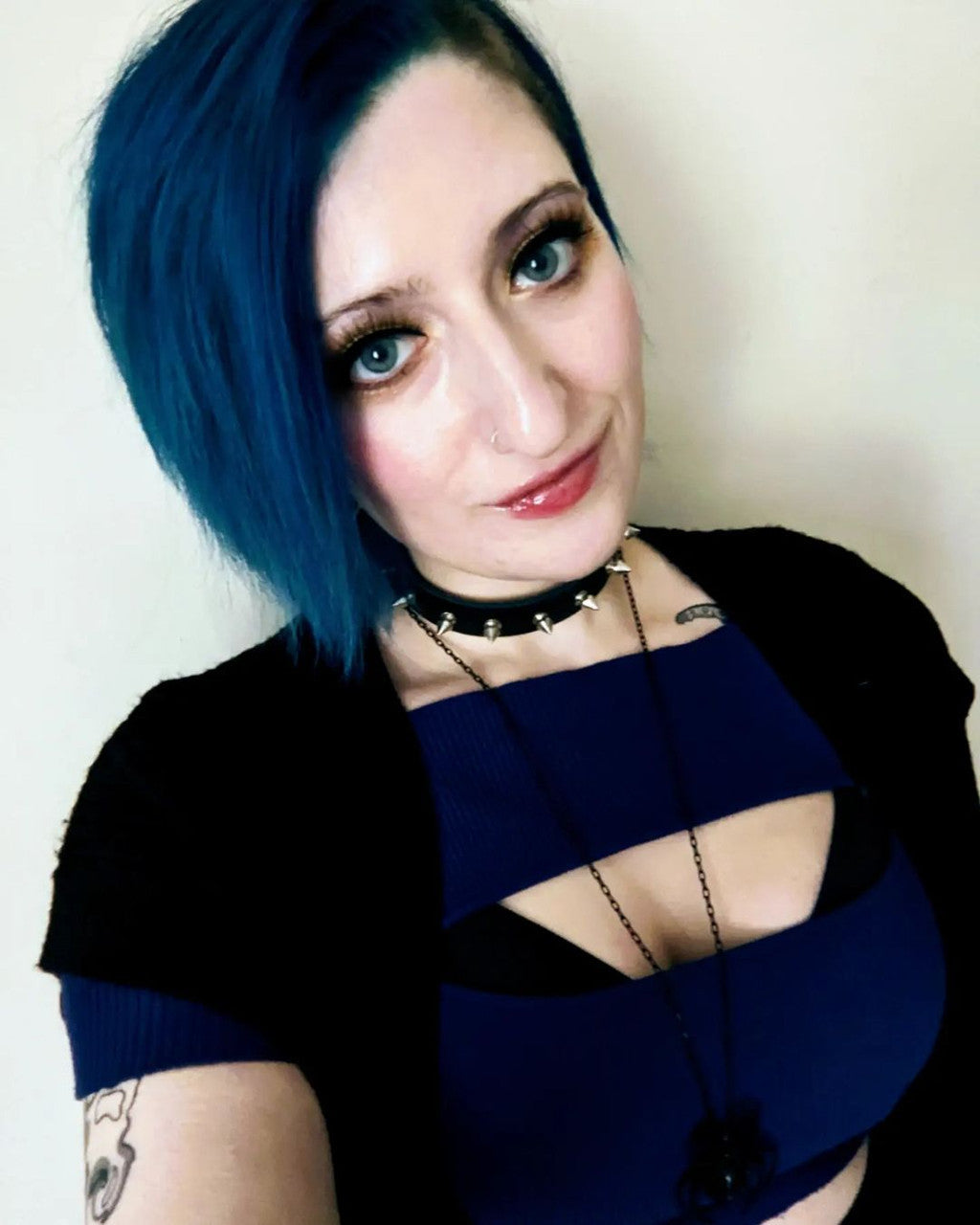 Crazy Color's Person with blue hair wearing a black top with cut-out design against a plain background by Afro Beauty Store