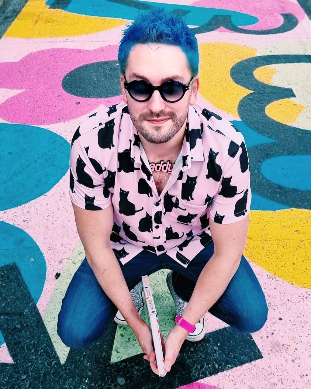 Crazy Color's person with black glasses and sky blue hair by Afro Beauty Store