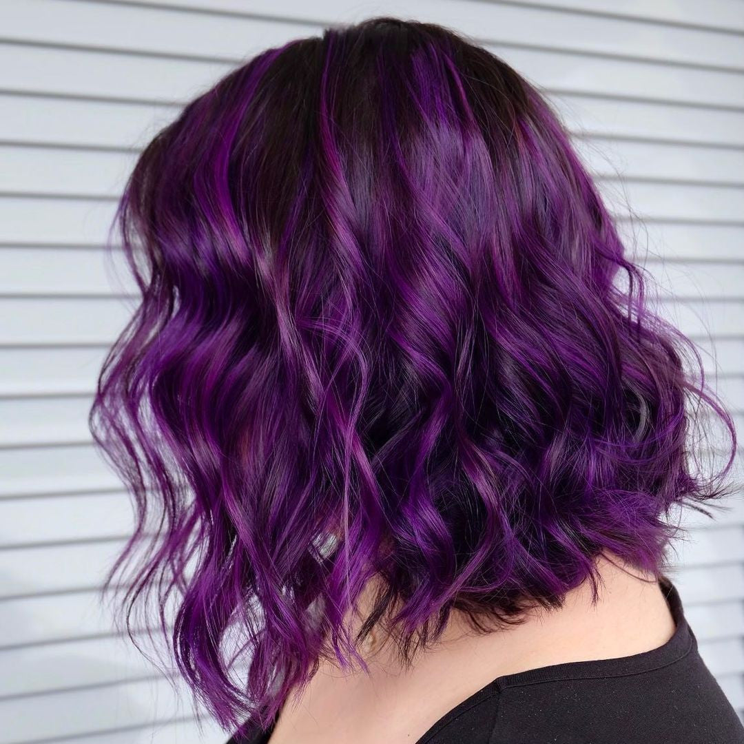 Crazy Color's Person with wavy purple hair against a neutral background by Afro Beauty Store