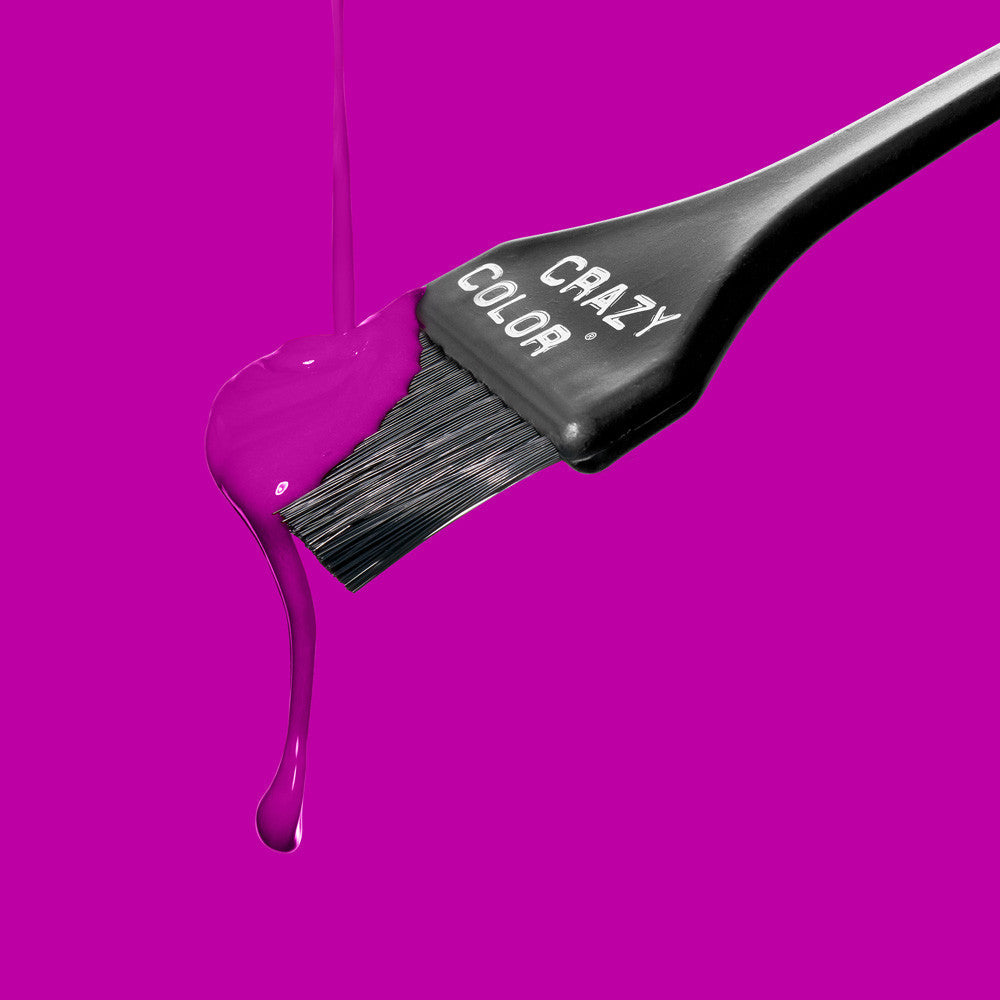 Crazy Color hair dye brush with purple dye By Afro Beauty Store on a pink background