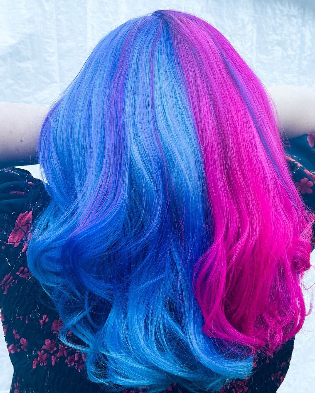 Crazy Color's Person with blue and pink hair against a light background by Afro Beauty Store