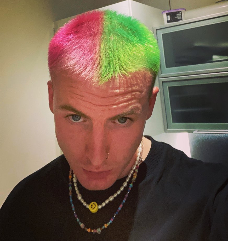 Crazy Color's Person with a colorful hairstyle in a kitchen setting by Afro Beauty Store