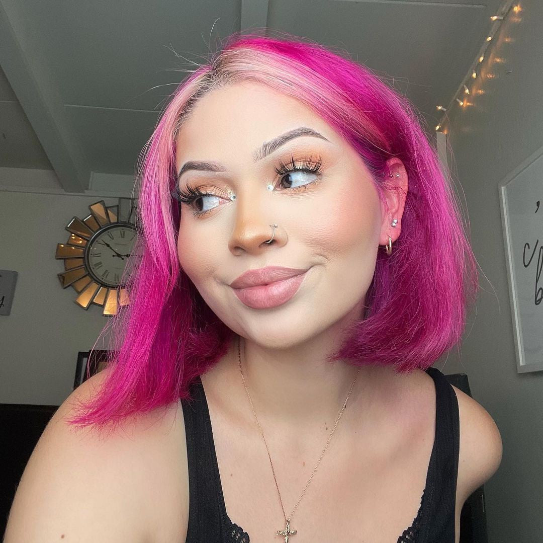 Crazy Color's Person with bright pink hair in a room with decorative elements by Afro Beauty Store