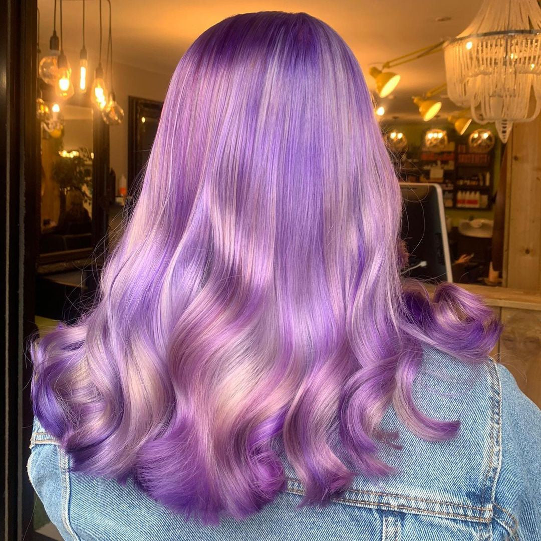 Crazy Color's Person with purple hair in a salon setting by Afro Beauty Store