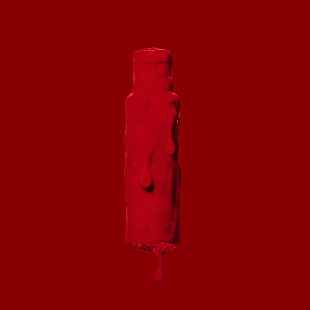 Red liquid bottle on a red background by Afro Beauty Store