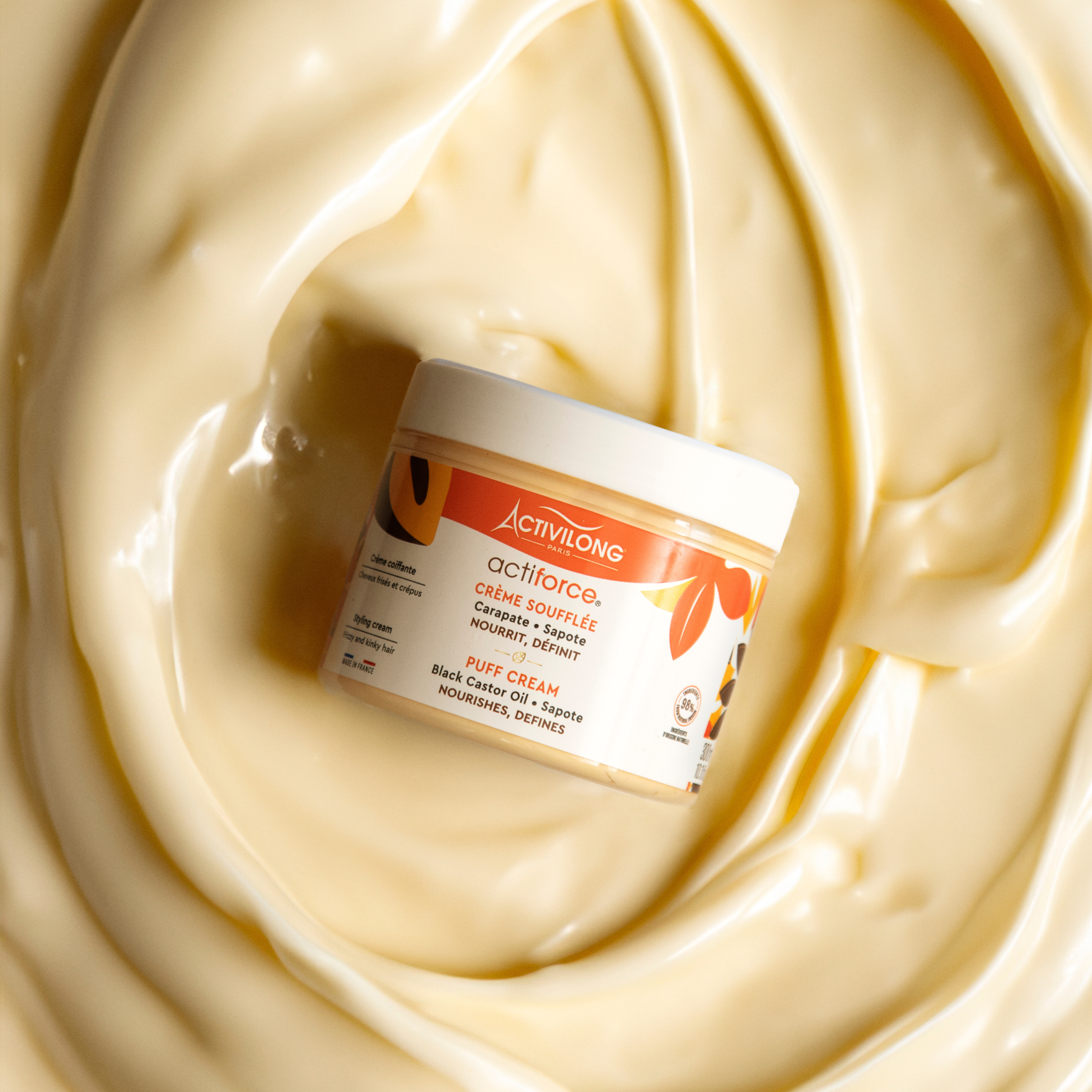 Jar of ACTIVILONG ACTIFORCE Crème Soufflée 300ml by Afro Beauty Store surrounded by creamy texture