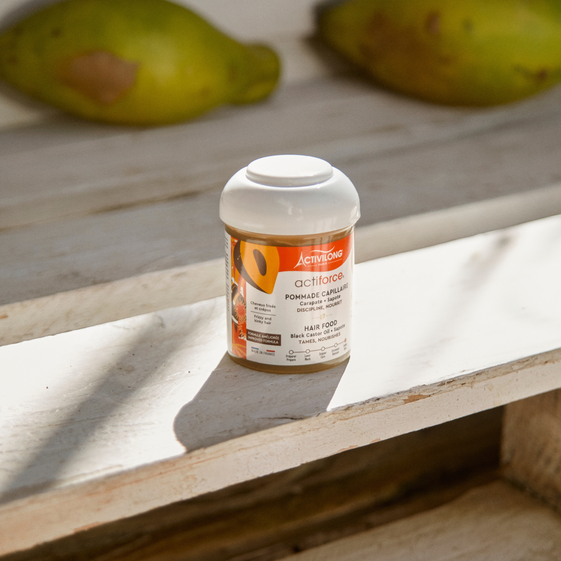 ACTIVILONG ACTIFORCE Pommade Fortifiante 100ml container by Afro Beauty Store on a wooden surface with fruits in the background