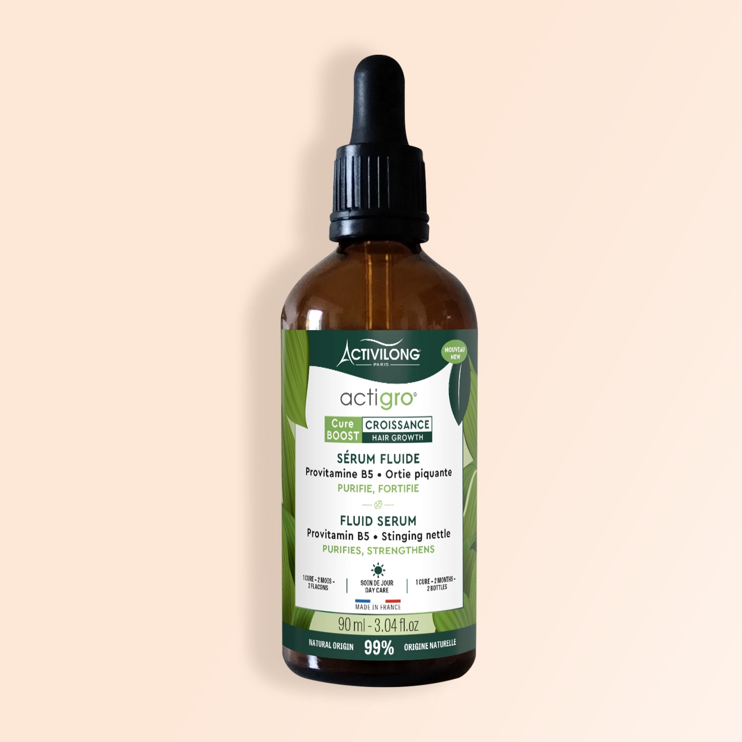 Bottle of ACTIVILONG ACTIGRO Sérum Fluide 90ml by Afro Beauty Store on a beige background