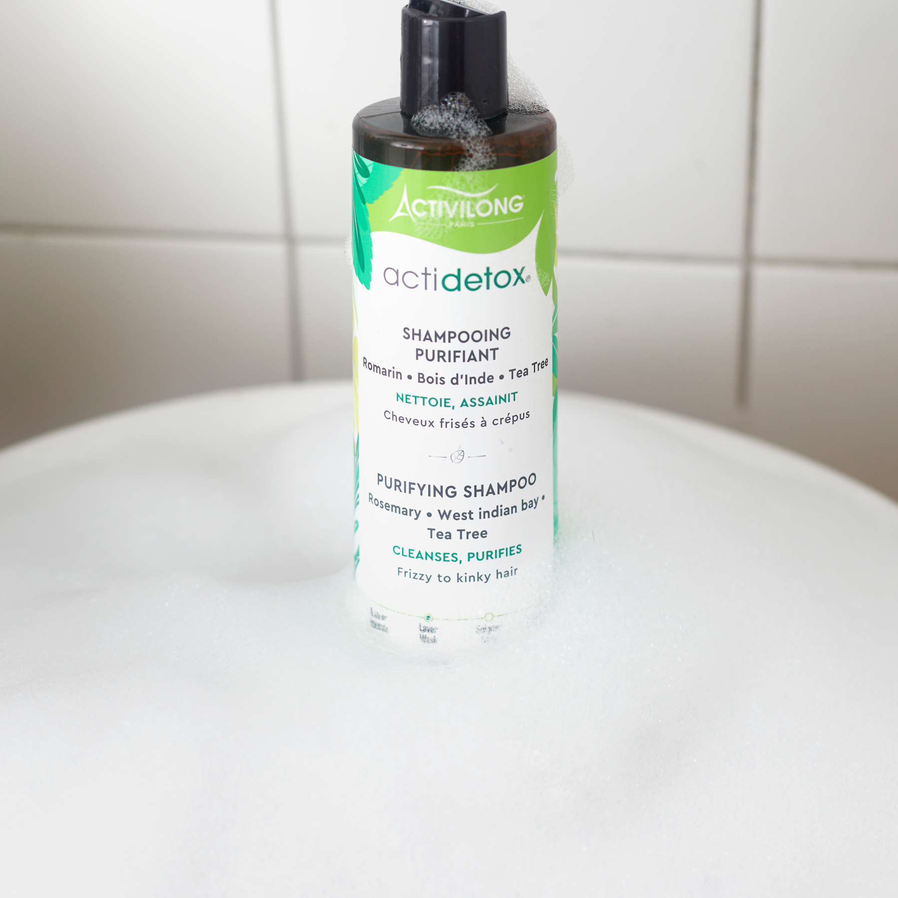 ACTIVILONG ACTIDETOX Shampooing Purifiant 250ml bottle by Afro Beauty Store on a white surface with a tiled wall background.