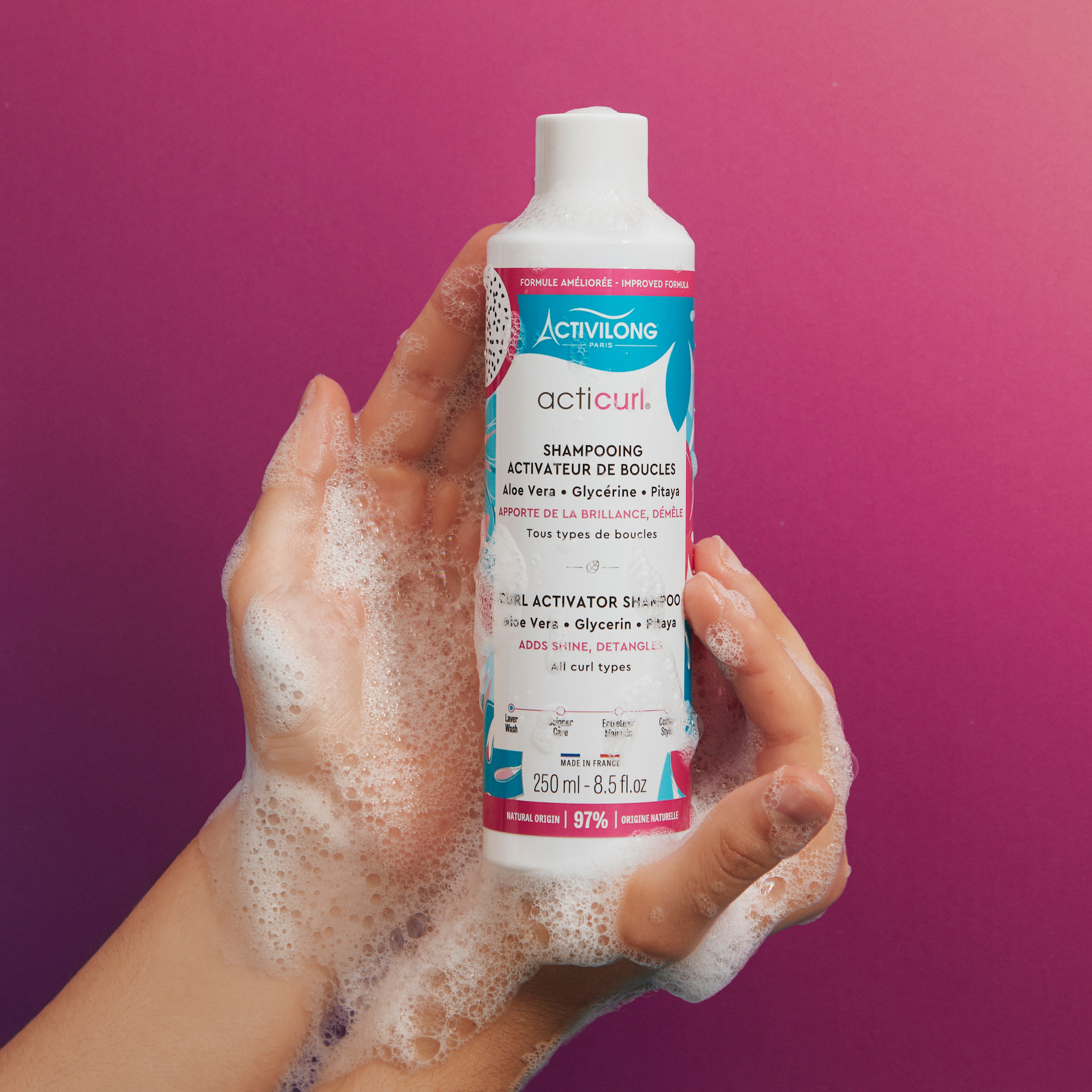 Hand holding a Bottle of ACTIVILONG ACTICURL Shampoing 250ml by Afro Beauty Store