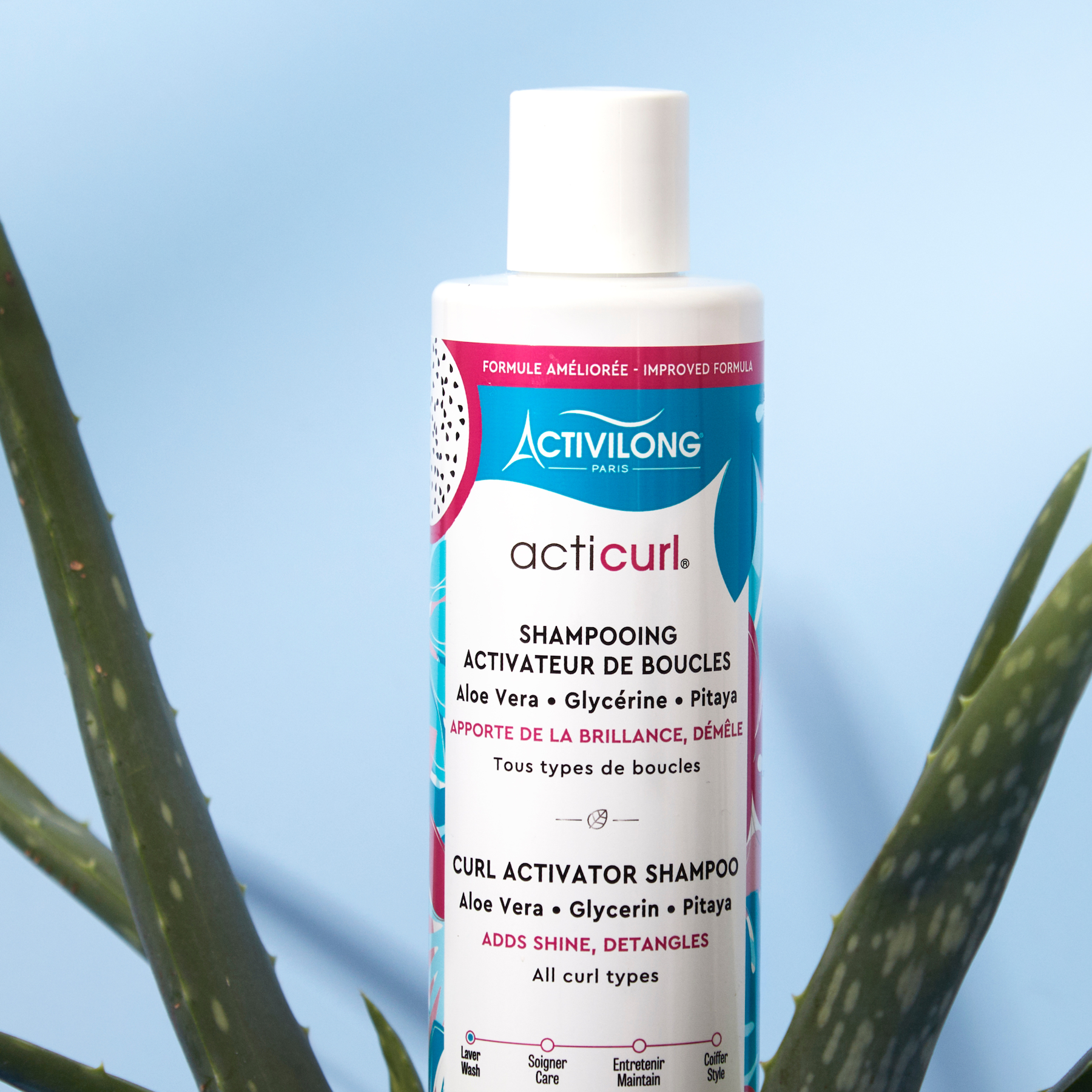 Bottle of ACTIVILONG ACTICURL Shampoing 250ml by Afro Beauty Store with aloe vera leaves in the foreground