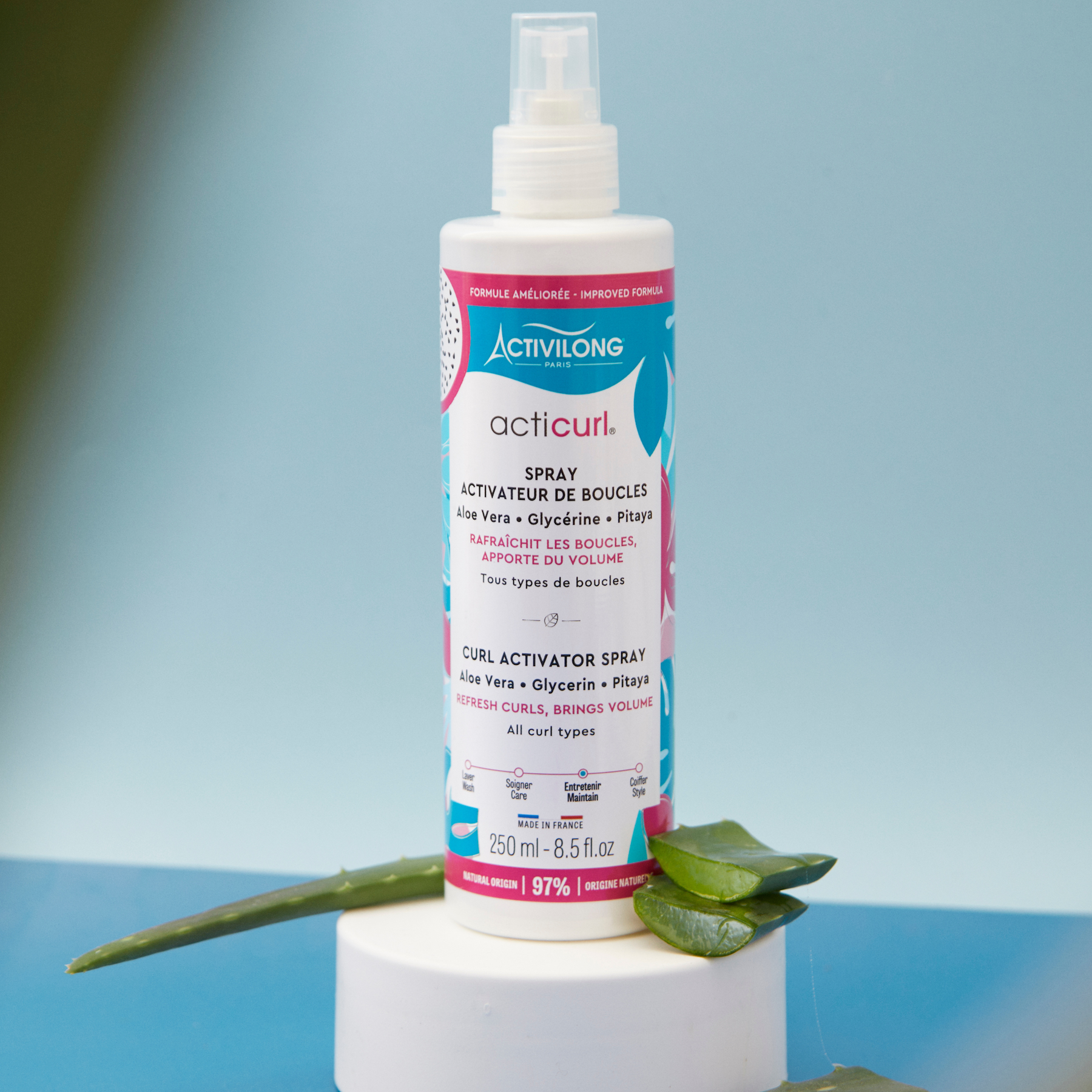 Bottle of ACTIVILONG ACTICURL Spray Activateur 250ml by Afro Beauty Store with aloe vera leaves on a blue background
