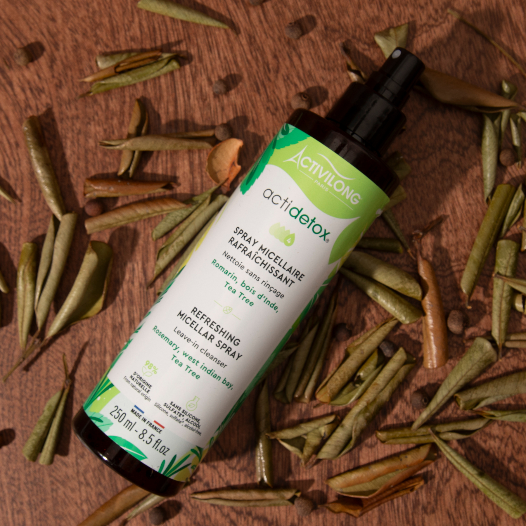 ACTIVILONG ACTIDETOX Spray Micellaire Rafraîchissant 250ml bottle by Afro Beauty Store on a wooden surface with dried herbs.