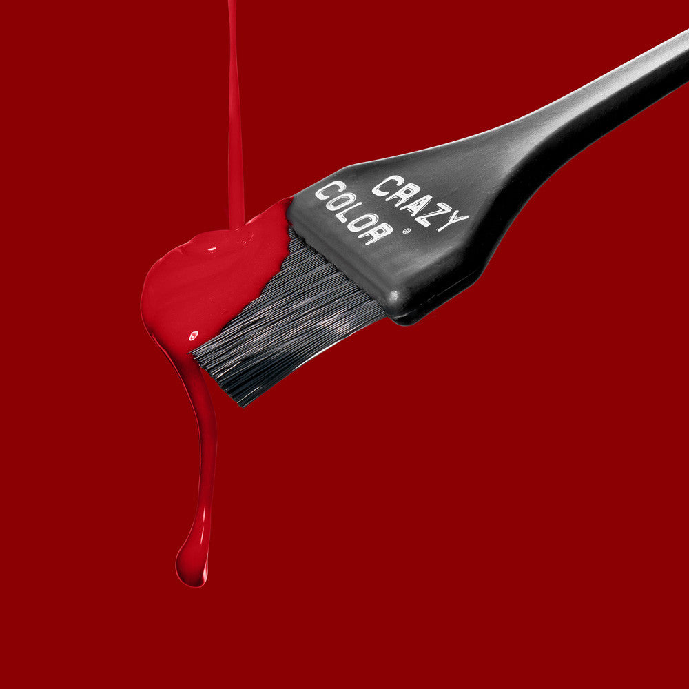 Hair dye brush with red color dripping on a red background, featuring the 'Crazy Color' brand by Afro Beauty Store.
